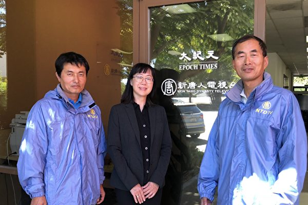 Three car donation staff in front of office